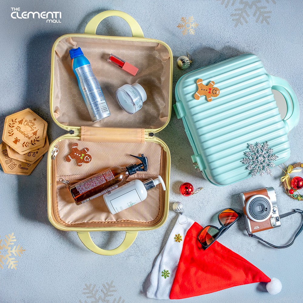 A collection of travel accessories, including a compact luggage.