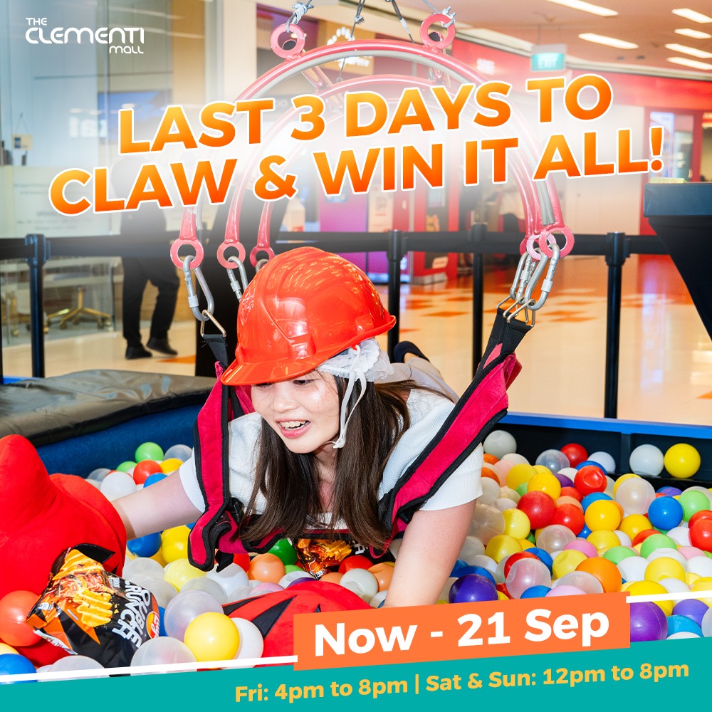 A person preparing to enter a human claw machine, surrounded by plush toys and prizes.