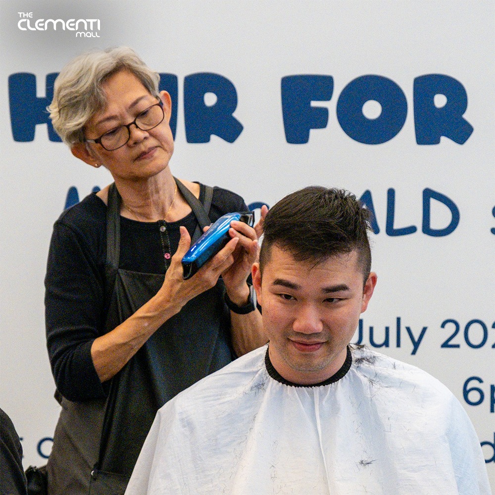Participants at a previous Hair For Hope event showing solidarity.