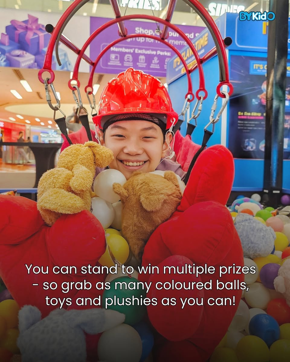 Oversized gloves ready for the Human Claw Machine challenge