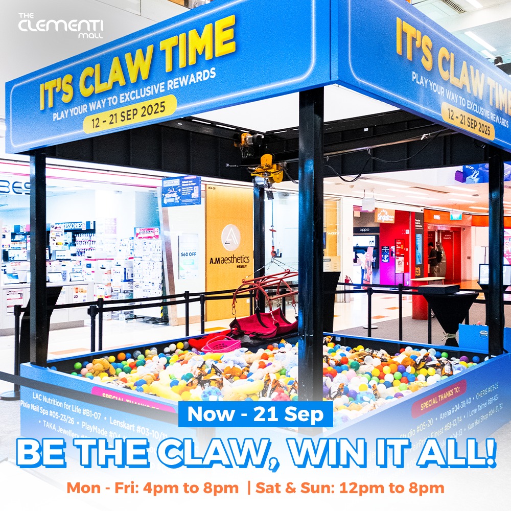 Shopper celebrating a successful grab from the Human Claw Machine